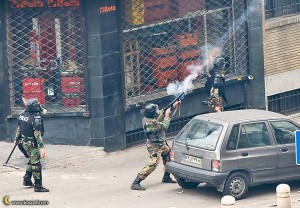 regime-police-goon-shoots-tear-gas